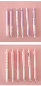 Close-up of pastel purple and pink retractable gel pens featuring diverse aesthetic patterns.