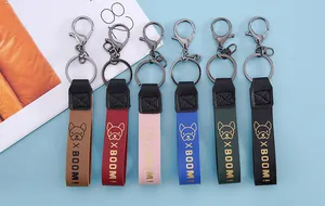 Set of colorful faux leather keychain straps with bulldog pattern and BOOM text