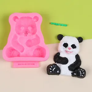 Detailed view of 3D sitting panda silicone mold with a finished plaster panda for DIY crafts