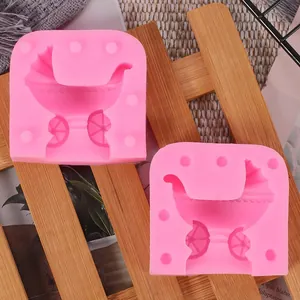 Close-up detail of a pink silicone baby stroller mold for DIY cake fondant and pudding