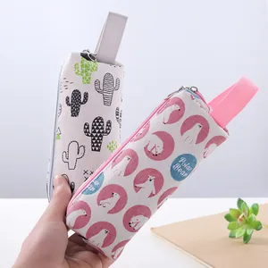Two cute cartoon canvas pencil cases featuring cactus and polar bear patterns for students