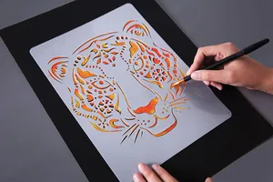 Creative tiger pattern painting stencil detail showing practical use on black board