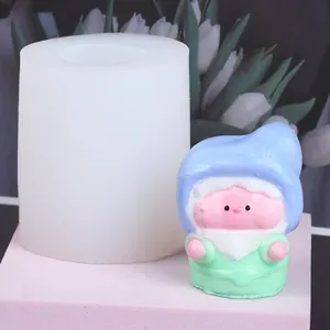 Detailed macro shot of 3D gnome silicone mold with a finished colorful elf figurine
