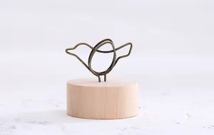 Vintage bird-shaped wire photo holder with round wooden base for home desk decor