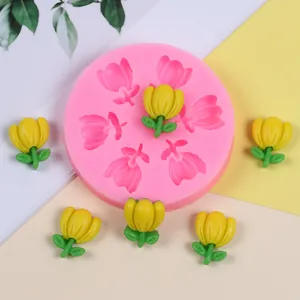Pink tulip silicone mold for chocolate, resin, or clay crafts shown with yellow floral pieces