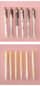 Collection of minimalist retractable gel pens with aesthetic patterns on pink background