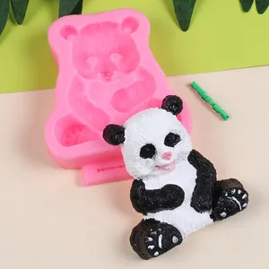 Detail view of 3D panda silicone mold with a finished black and white resin panda model