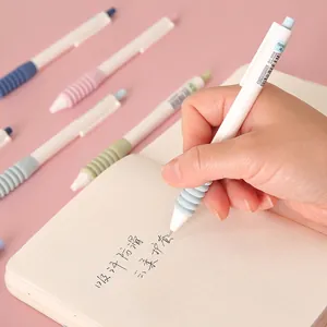 Retractable gel pen with a soft cloud grip for comfortable writing on a grid notebook