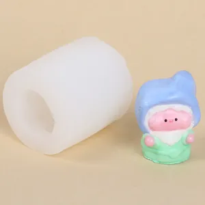 Detailed view of a 3D gnome silicone mold alongside a finished colorful elf figurine