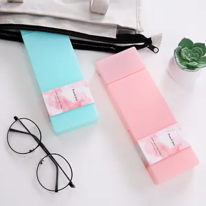 Minimalist solid color PP plastic pencil boxes in candy green and pink for students