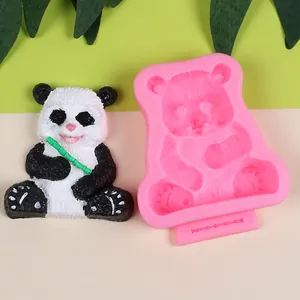 Detail view of 3D panda silicone mold with a finished hand-painted panda figurine.