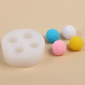 Detailed macro view of a 4-cavity silicone bayberry ball mold with colorful finished samples
