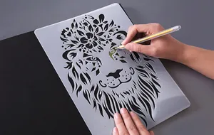 Detailed shot of a lion stencil used for creative animal-themed drawing on black paper