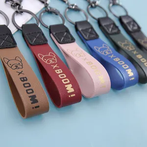 Multiple colors of leather strap keychains with French Bulldog 'X BOOM!' print