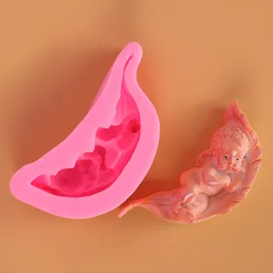 Detailed view of baby on leaf silicone mold and finished clay figure