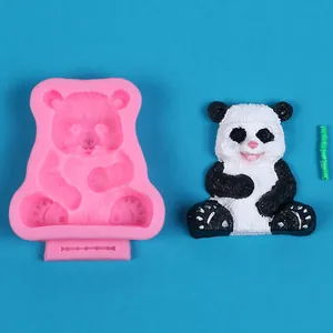 Detail of 3D panda silicone mold with finished black and white panda plaster craft
