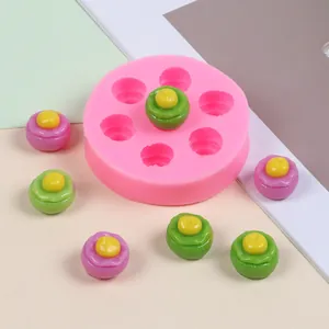 Detail view of pink multi-cavity silicone mold with mini candy-shaped finished pieces