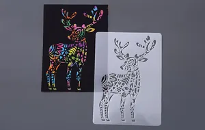 Detailed view of a translucent deer stencil next to a vibrant rainbow scratch art card.
