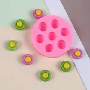 Close-up top view of a pink 7-hole mini dessert silicone mold for DIY resin crafts