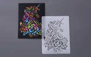 Detailed close-up view of unicorn painting stencil and colorful scratch art card set
