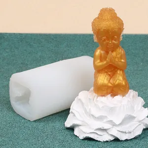 Detailed view of DIY silicone mold showing small Buddha candle figure and white mold