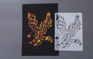 Detailed view of an eagle painting stencil and its gradient artwork on black card
