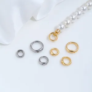 Detailed view of stainless steel pig nose double-hole ring connectors for DIY jewelry making