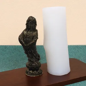 Detailed macro view of the white silicone mold and its Guanyin statue finished sample