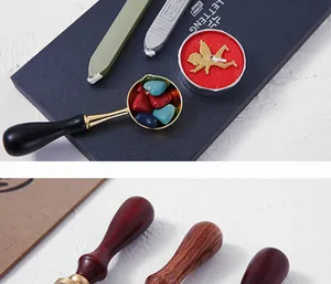 Detailed view of vintage wax seal kit featuring heart-shaped beads and wood handles