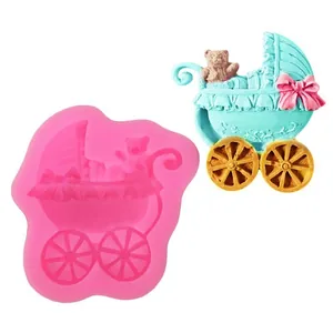 Detailed macro view of a baby stroller silicone fondant mold with a finished example