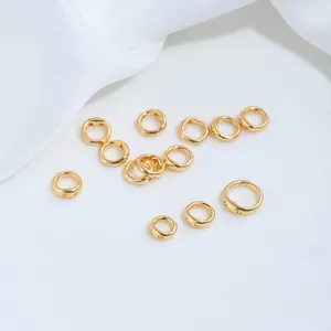 Detailed macro view of gold stainless steel double-hole ring connectors for DIY jewelry