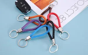 Detailed view of colorful braided leather keychains in six vibrant colors with metal rings
