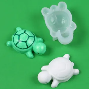 Detail view of mini turtle silicone mold with finished resin and plaster ornaments.