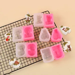 Detailed view of number 1-5 silicone candle molds with finished cartoon animal candles
