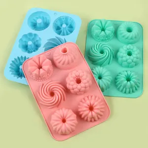 Set of three 6-cavity silicone baking molds in pastel pink, blue, and green colors.