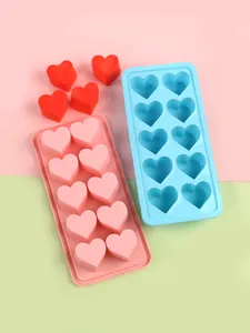 Detailed view of 10-cavity pink and blue heart-shaped silicone ice cube and chocolate molds.