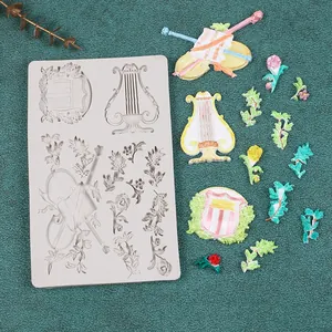 Dettaglio dello stampo in silicone per strumenti musicali europei con violino e arpa per DIY