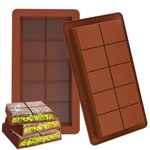 Detail shot of a brown silicone chocolate mold with finished green-filled chocolate bars