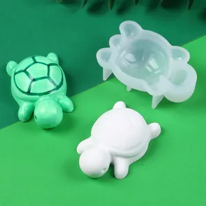 Detail shot of mini turtle silicone mold with finished resin and plaster samples