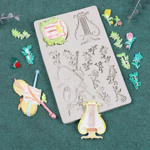 Vista dettagliata dello stampo in silicone con motivi di violino e arpa per dolci