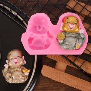 Detail of pink silicone mold showing Maitreya Buddha cavity and finished resin cast