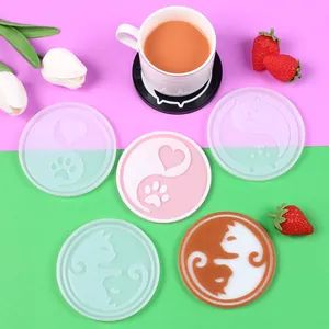 DIY silicone molds for coasters with cartoon cat and paw patterns for resin art.