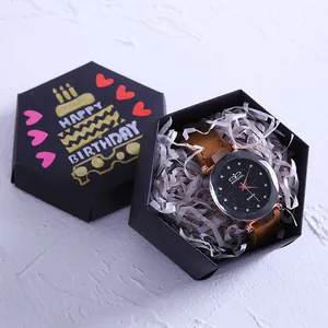 Elegante reloj de mujer con esfera estrellada en una caja de regalo Happy Birthday