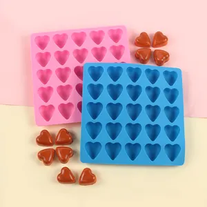 Close-up detail of 25-cavity heart-shaped silicone molds for chocolate and ice cubes