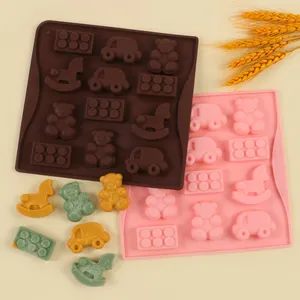 Close-up of silicone cake molds with bear and car shapes for fondant decoration