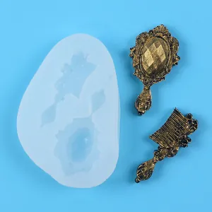 Close-up detail of vintage style mirror and comb silicone mold for fondant cake decoration