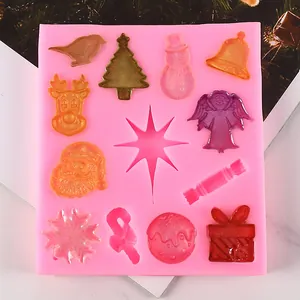 Close-up of pink silicone Christmas mold with various festive shapes for resin or baking