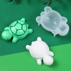 Detail view of DIY mini turtle silicone mold with green and white finished resin models