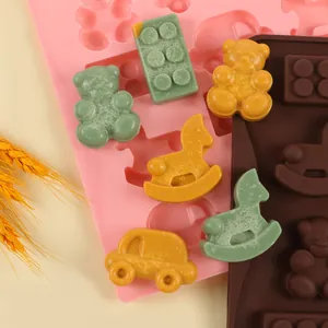 Detailed macro view of colorful animal and vehicle shaped chocolates made with silicone molds