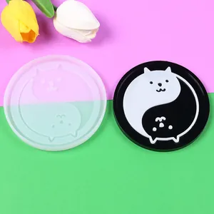 Detailed macro view showing the cat Yin-Yang pattern silicone resin mold and finished coaster